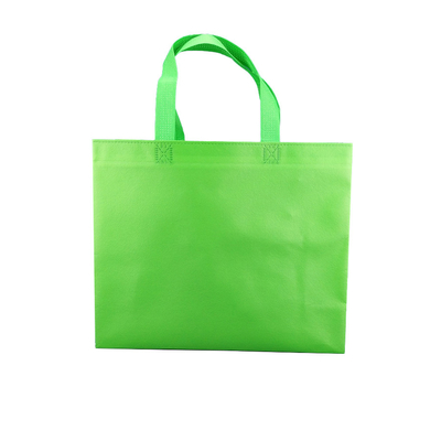 L'acquisto del totalizzatore ricicla non tessuto porta i sacchetti della spesa di drogheria riutilizzabili non tessuti di logo su ordinazione biodegradabile verde delle borse della borsa