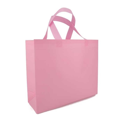 La drogheria ha stampato gli strizzacervelli respirabili non tessuti di rosa 65gsm dei sacchetti della spesa resistenti