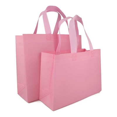 La drogheria ha stampato gli strizzacervelli respirabili non tessuti di rosa 65gsm dei sacchetti della spesa resistenti
